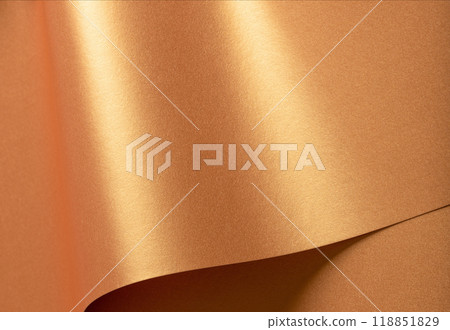 Golden paper with a metallic texture and chic waves, featuring a glowing gradient and shiny 118851829