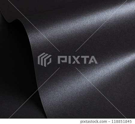 Black paper with a textured surface and minimalist, monochrome background. The premium structure Black paper with a textured surface and minimalist, monochrome background. The premium structure 118851845
