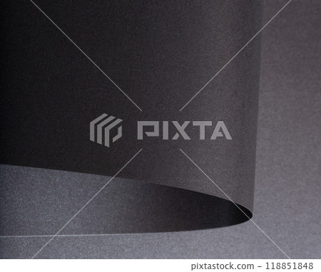 Black paper with a rich texture and minimalist monochrome background. The design features bent and 118851848