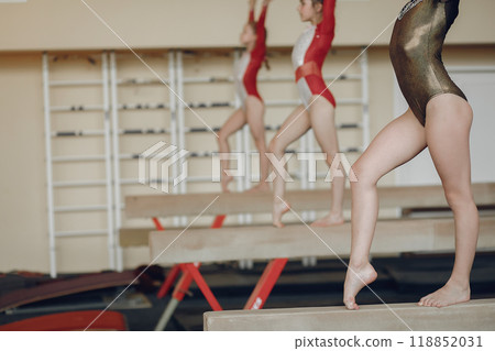 Rhythmic gymnastics. Girls gymnasts, performs various gymnastic exercises and jumping. Childs and sport, a healthy lifestyle. 118852031