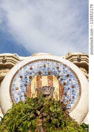 Multicolored mosaic of Salamander or Dragon. Lizard Fountain at Park Guell, popular touristic objects in Barcelona, Spain. Multicolored mosaic of Salamander or Dragon. Concept of tourism and vacation Multicolored mosaic of Salamander or Dragon. Lizard Fountain at Park Guell, popular touristic objects in Barcelona, Spain. Multicolored mosaic of Salamander or Dragon. Concept of tourism and vacation 118852179