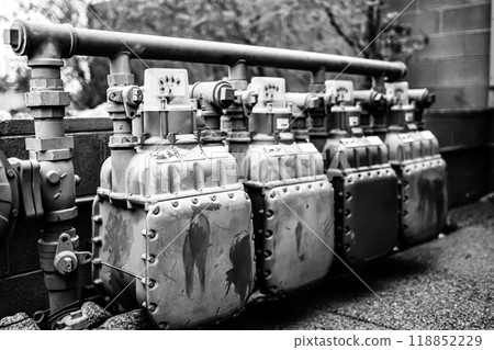 Row of gas meters feeding businesses outside.  118852229