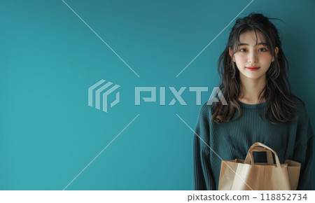 Web banner with a beautiful girl with a shopping bag on a blue background, with space for the concept of advertising Black Friday and seasonal sales 118852734