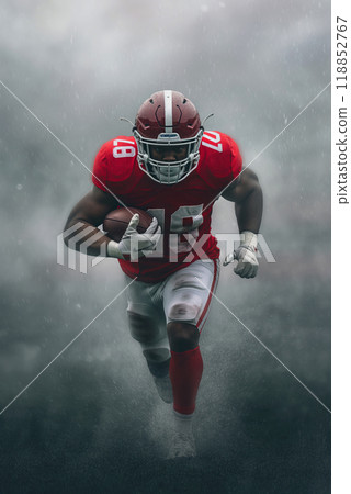 portrait of an American football player running quickly across the field with the ball through the smoke, vertical poster for the cup portrait of an American football player running quickly across the field with the ball through the smoke, vertical poster for the cup 118852767