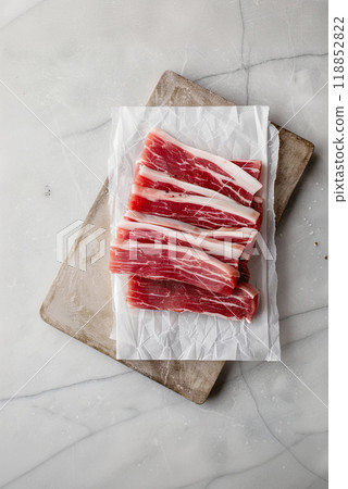 Fresh pork belly pieces on parchment paper, flat lay, vertical poster Fresh pork belly pieces on parchment paper, flat lay, vertical poster 118852822