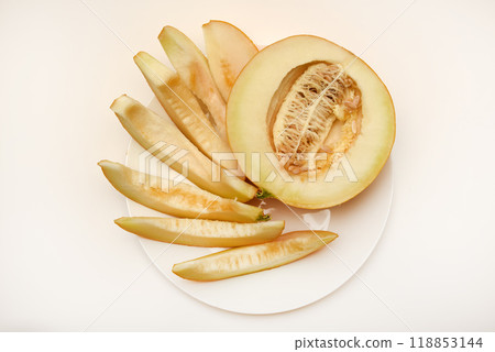 Juicy melon on a plate. Sweet melon cut into pieces. Juicy melon on a plate. Sweet melon cut into pieces. 118853144