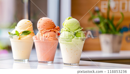 Fruit dessert in containers on a table in a cafe, fruit ice cream and plant milk, copy space for vegetarian cuisine concept Fruit dessert in containers on a table in a cafe, fruit ice cream and plant milk, copy space for vegetarian cuisine concept 118853236
