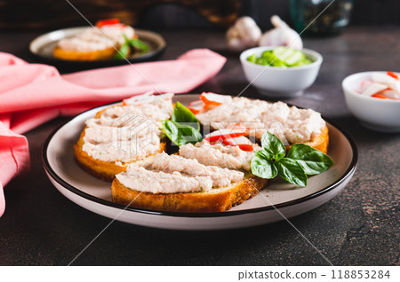 Crab stick and cucumber pate on toast on a plate on the table Crab stick and cucumber pate on toast on a plate on the table 118853284