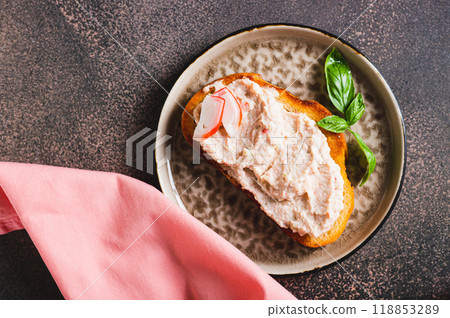 Close up os crab stick and cucumber pate on toast on a plate on the table vertical view Close up os crab stick and cucumber pate on toast on a plate on the table vertical view 118853289