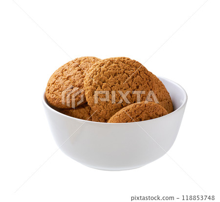 Round oatmeal cookies in a ceramic bowl isolated on white background. 118853748