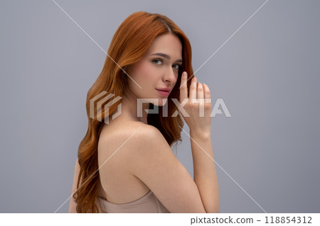 Beautiful young ginger woman looking peaceful and relaxed Beautiful young ginger woman looking peaceful and relaxed 118854312