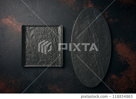 Oval and square stone kitchen board on black background, top view 118854863