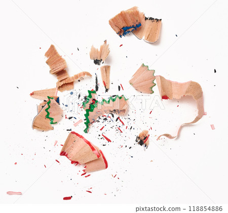 Wood shavings from multi-colored wooden pencils on white background, top view 118854886