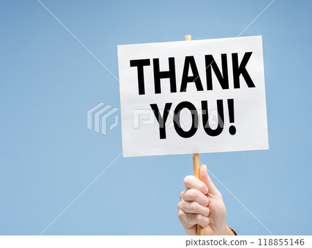 Male hand holding sign with the phrase THANK YOU! against a blue background Male hand holding sign with the phrase THANK YOU! against a blue background 118855146