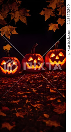 Decorative Halloween pumpkins with carved faces, autumn leaves, and a lantern 118855260