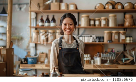 Small business owner cheerfully preparing their store for a busy day ahead Small business owner cheerfully preparing their store for a busy day ahead 118856676