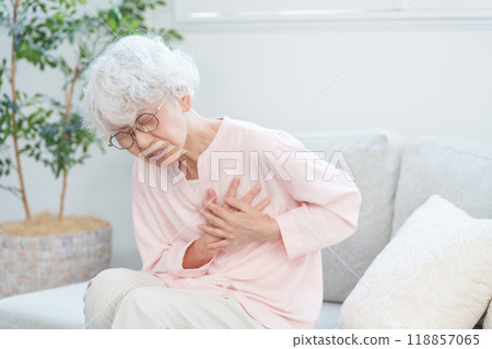 Senior woman with chest pain 118857065