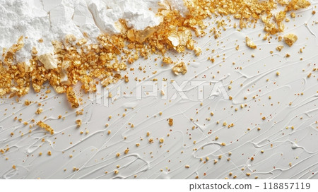 A close up of a white and gold cake with sprinkles, AI 118857119