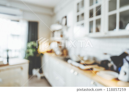 Blurred background modern kitchen and dinning room in house with bokeh light Blurred background modern kitchen and dinning room in house with bokeh light 118857259