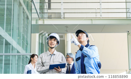 People of various professions inspecting a building (engineers, security guards, businessmen, researchers) People of various professions inspecting a building (engineers, security guards, businessmen, researchers) 118858890