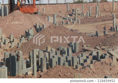 Construction work zones of piling where piles are driven into the ground. 118859452