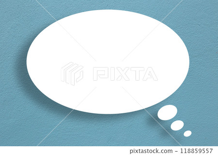 White circle paper speech bubble shape against dark blue wall color background. White circle paper speech bubble shape against dark blue wall color background. 118859557
