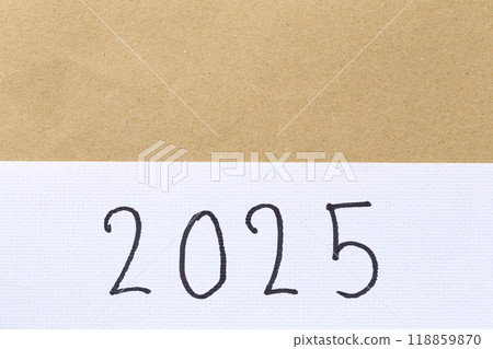 Numbers two thousand twenty-five are hand-written on white art paper background. 118859870