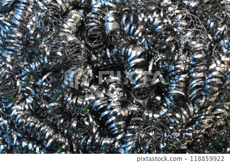 Scrap iron cut from steel bars in lathes background. 118859922