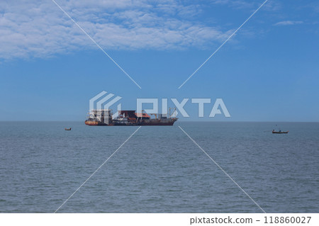 Sand suction boat moored on the sea shore of Jomtien Beach of Pattaya City. 118860027