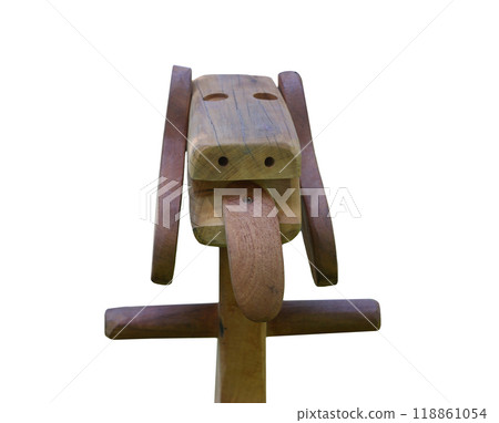 Shape of the wooden is made into a dog's head that is sticking out its tongue isolated on white. Shape of the wooden is made into a dog's head that is sticking out its tongue isolated on white. 118861054
