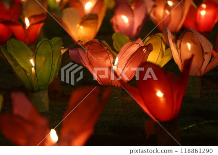 Candles are lit in colorful lanterns at the Loi Krathong festival. 118861290
