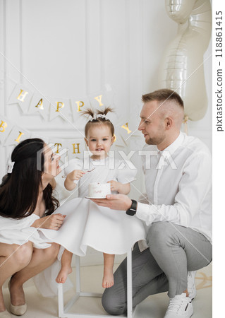 Family celebrates child's birthday with joy and love Family celebrates child's birthday with joy and love 118861415