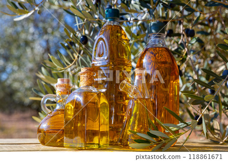 Glass bottles and carafes with olive oil 118861671