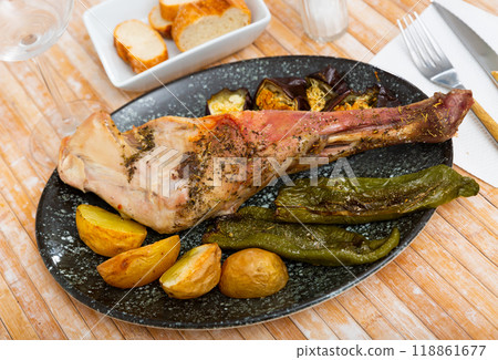 Roasted lamb shoulder with vegetables Roasted lamb shoulder with vegetables 118861677