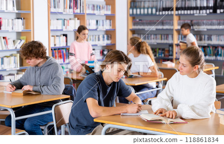 Schoolchildren write out a synopsis from the textbook Schoolchildren write out a synopsis from the textbook 118861834
