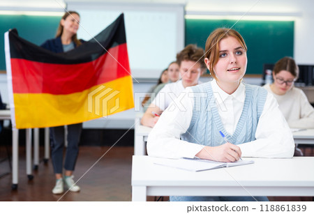 Young girl student diligently studies at school 118861839