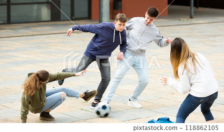 Cheerful schoolchildren are playing football Cheerful schoolchildren are playing football 118862105