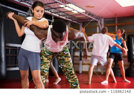 Active woman training captures on self-defense course Active woman training captures on self-defense course 118862148