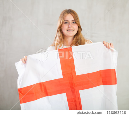 Portrait of positive young girl holding England flag 118862318