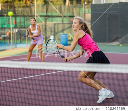 Portrait of emotional woman tennis player during friendly doubles couple match Portrait of emotional woman tennis player during friendly doubles couple match 118862369