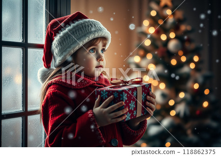 A girl with a Christmas gift A girl with a Christmas gift 118862375