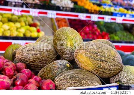 Sweet melons on the counter of the fruit store 118862394