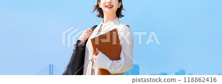 Blue sky and smiling business woman 118862416