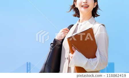 Blue sky and smiling business woman Blue sky and smiling business woman 118862419