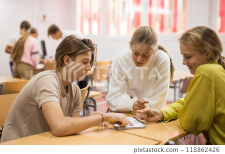 Schoolchildren study together in group lessons in school class 118862426