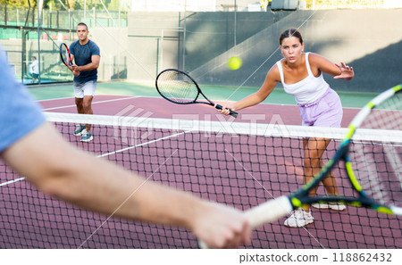 Young woman playing tennis on court 118862432