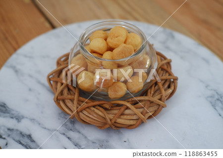 a traditional cake from Indonesia called kue sus filled with cream puffs 118863455