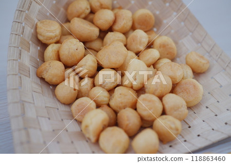 a traditional cake from Indonesia called kue sus filled with cream puffs 118863460