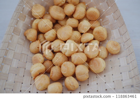 a traditional cake from Indonesia called kue sus filled with cream puffs 118863461