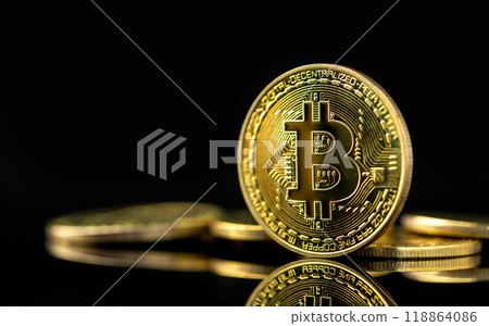 Bitcoin on dark background, Close up golden bitcoin a digital currency, operates on a decentralized system with transactions recorded and new units created without central authority 118864086